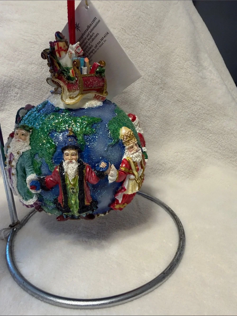 Christopher Radko Santa’s around the world with tag